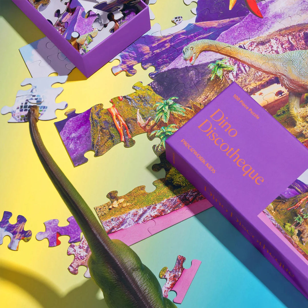 Dinosaur-themed puzzle with pieces and packaging on a colorful background