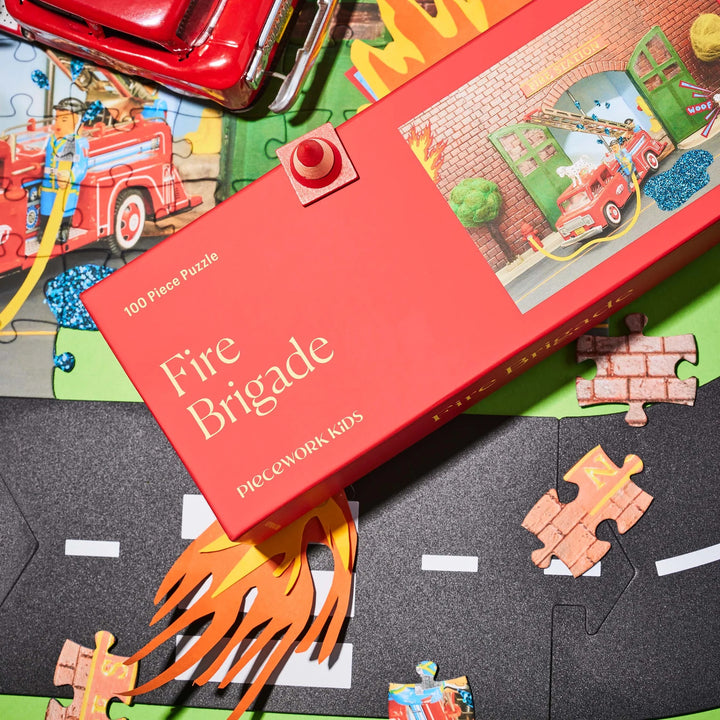 Fire Brigade puzzle set with pieces and box on a colorful base
