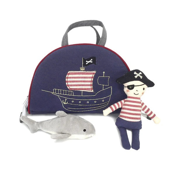 Pirate-themed toy set with a backpack, pirate doll, and shark on a white background