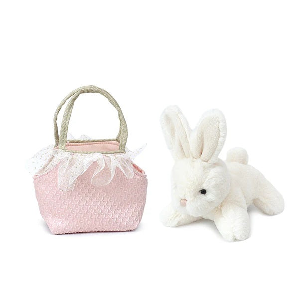 Pink textured basket with lace details and a white plush bunny on a white background