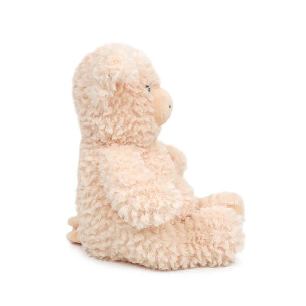Plush toy resembling a pig on a white background