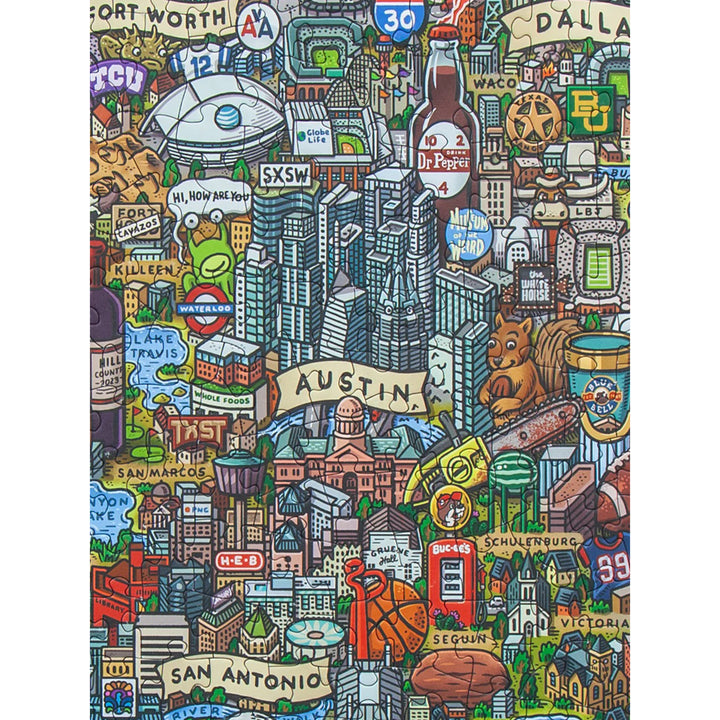Colorful puzzle map of Texas with various symbols and landmarks